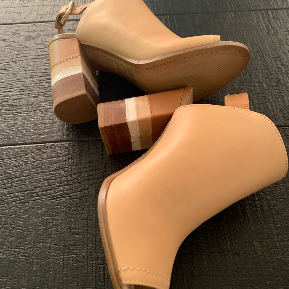 Brand new, Mule Style. Nice tan color, heel has different tones.